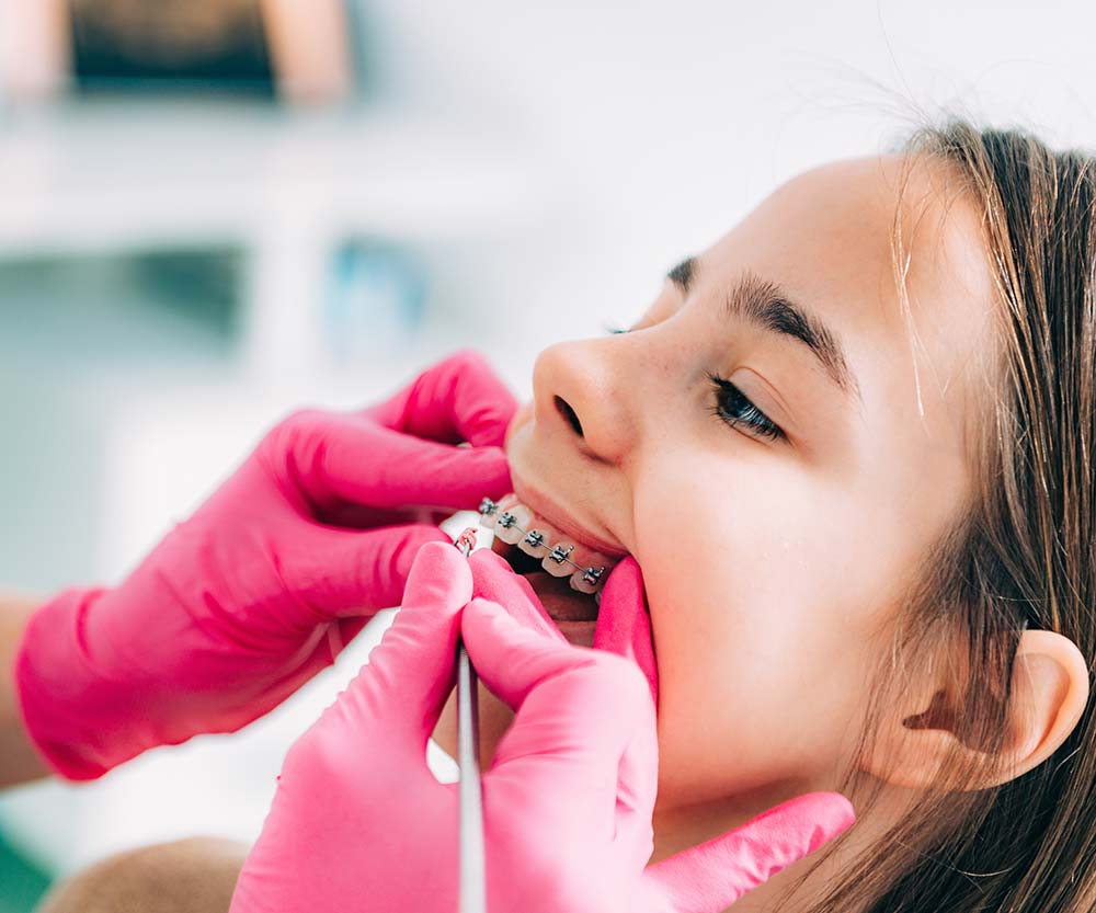 Child with Braces at Check-up