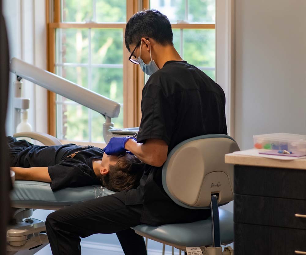 Orthodontist Dr. Lin Placing Invisalign